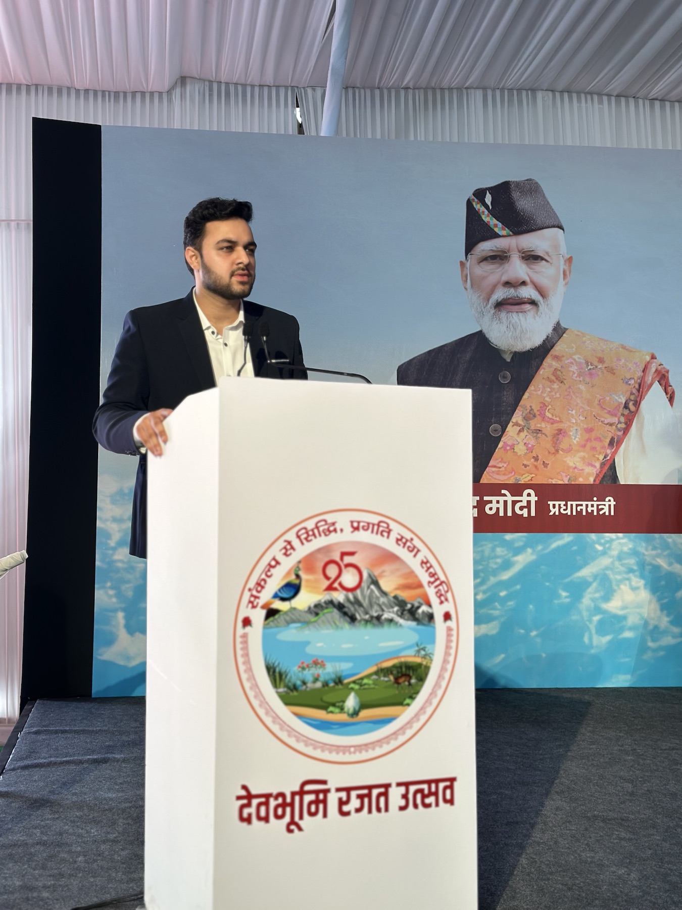 Manthan presenting DigiStay to PM Narendra Modi at a government summit.